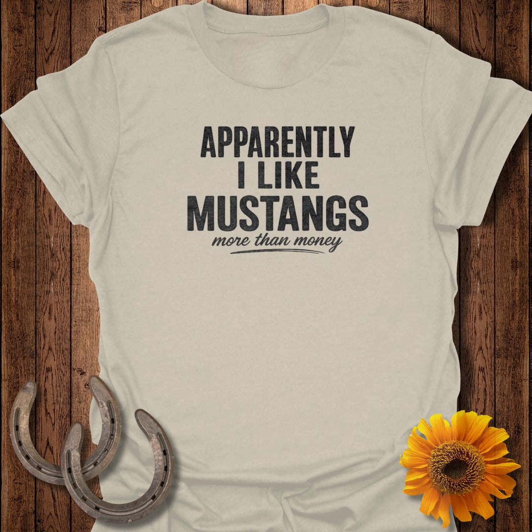 Cream t-shirt with "Apparently I Like Mustangs More Than Money" text, horseshoes, and sunflower.