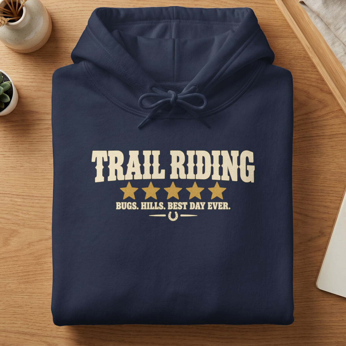 Navy hoodie with "TRAIL RIDING" and "BUGS. HILLS. BEST DAY EVER." text.
