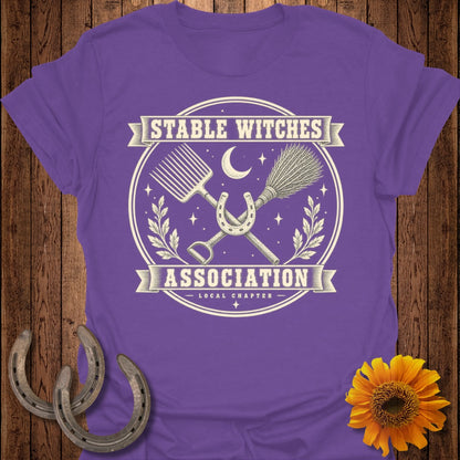 Purple t-shirt with "Stable Witches Association Local Chapter" text and equestrian graphics.