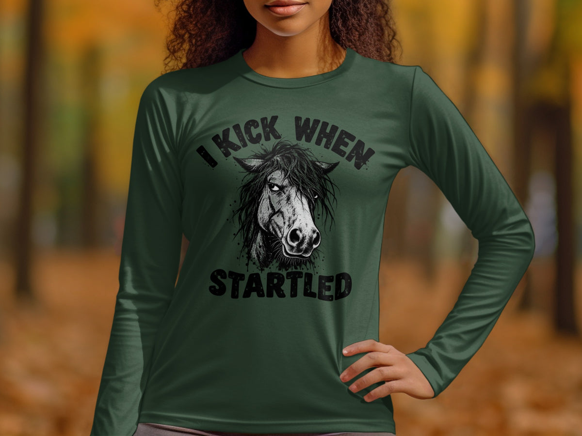 Dark green long sleeve shirt with black graphic of a horse and text "I KICK WHEN STARTLED".