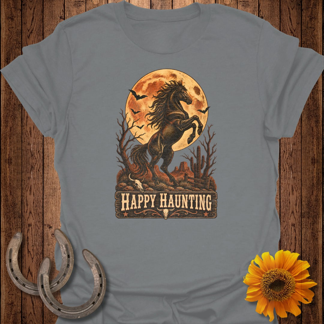 T-shirt graphic with a rearing horse under a full moon, featuring bats and desert scenery.