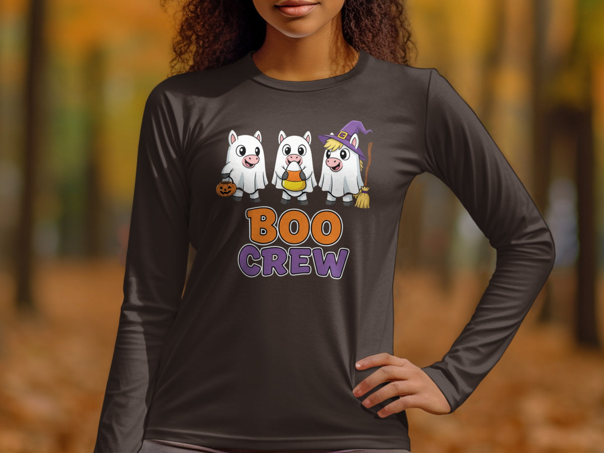 Three white unicorns in Halloween costumes saying "BOO CREW".