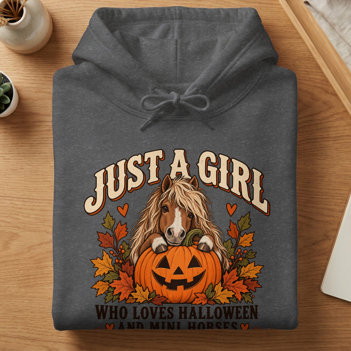 Dark gray hoodie with text and graphic of a horse and pumpkin.