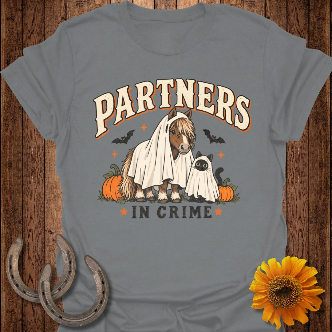 Horse and cat dressed as ghosts with pumpkins and bats, text says "Partners in Crime."