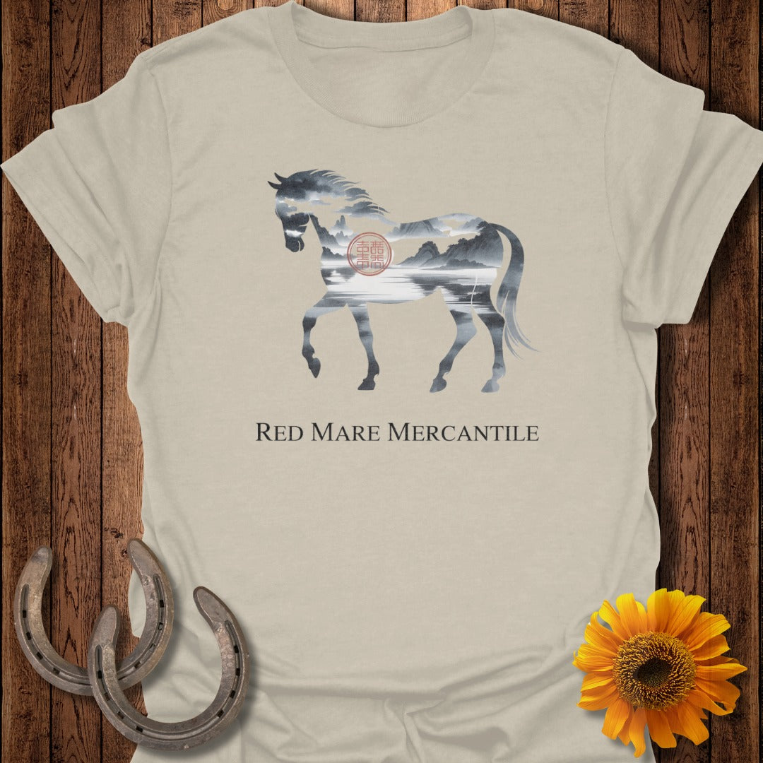 Light tan t-shirt with a silhouette of a horse filled with a landscape, and text.