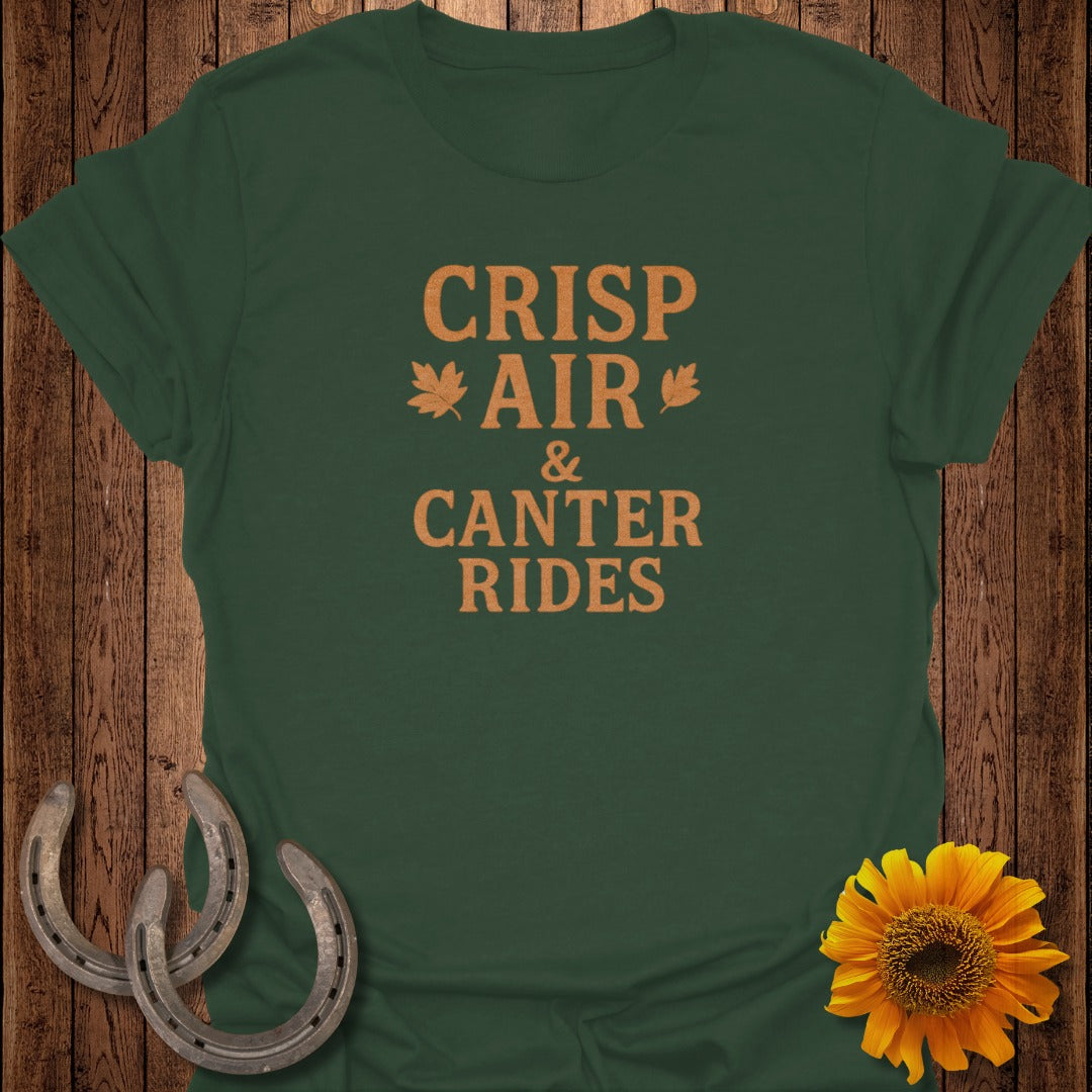 Green t-shirt with "CRISP AIR & CANTER RIDES" text, maple leaves, horseshoes, and sunflower.