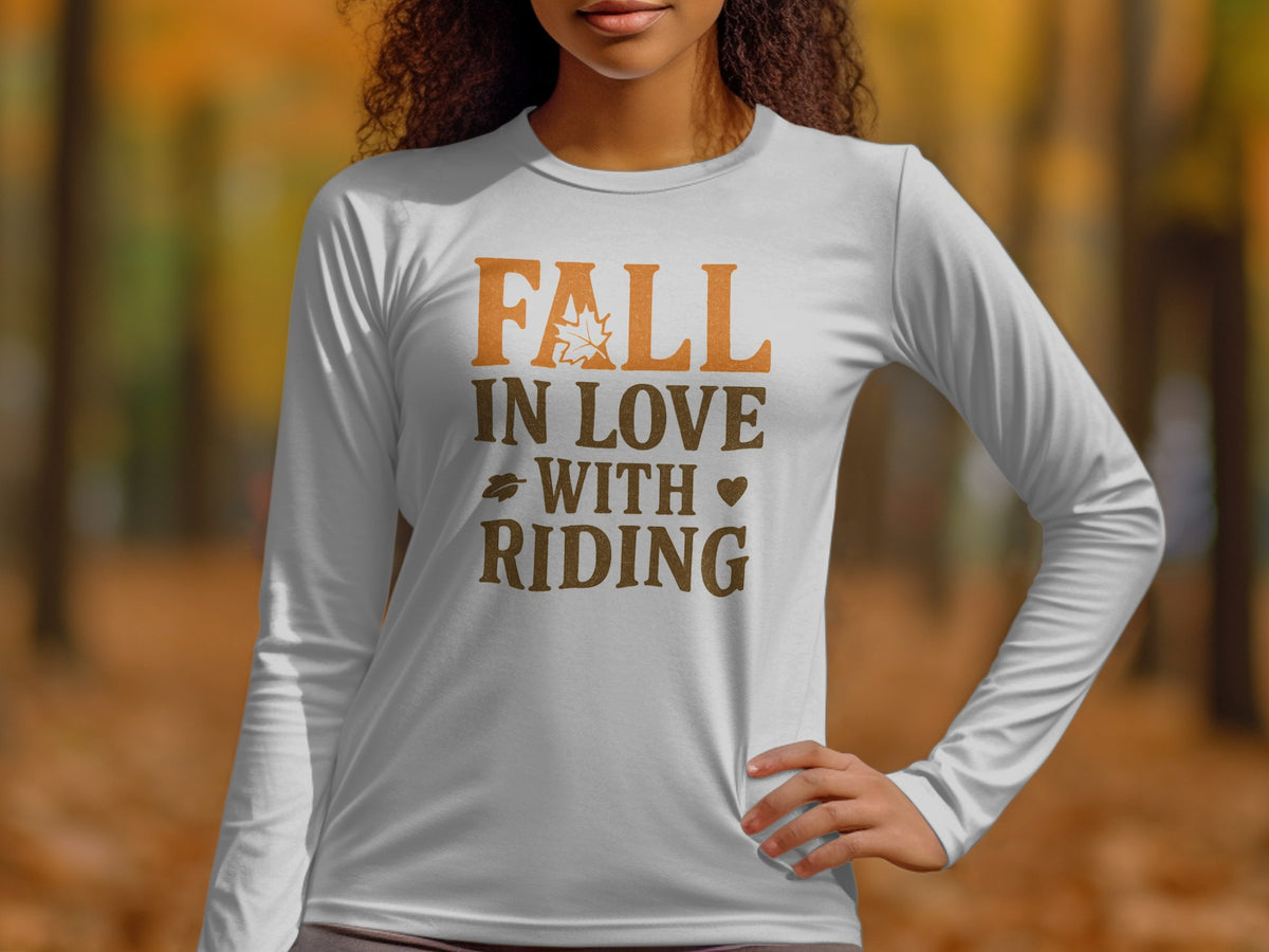 White long-sleeve shirt with "Fall In Love With Riding" text and autumn leaf graphic.