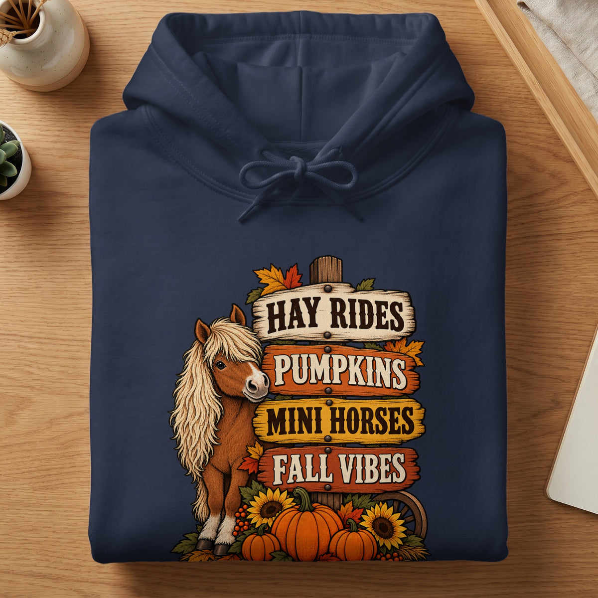 Navy hoodie with "Hay Rides, Pumpkins, Mini Horses, Fall Vibes" text and horse graphic.