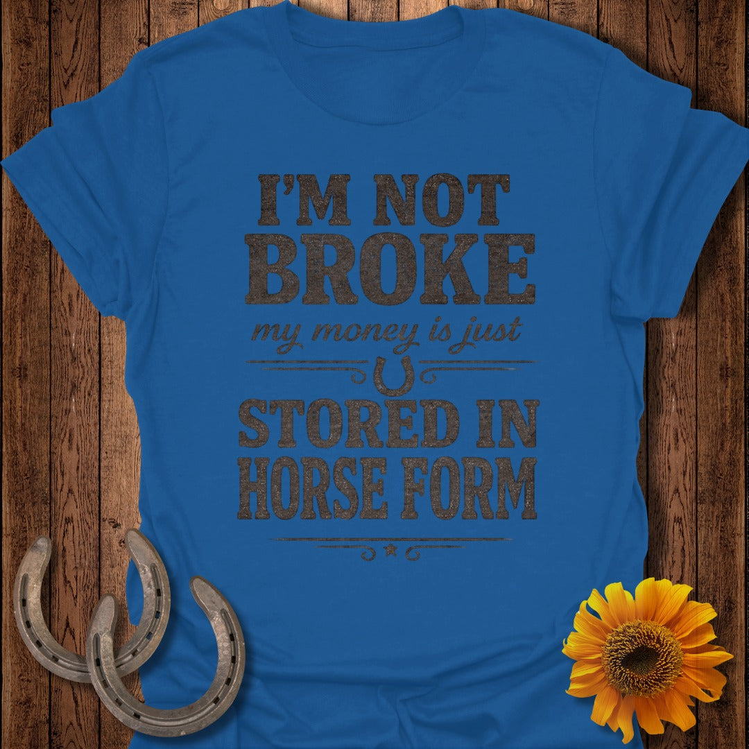 Blue t-shirt with "I'm not broke, my money is just stored in horse form."