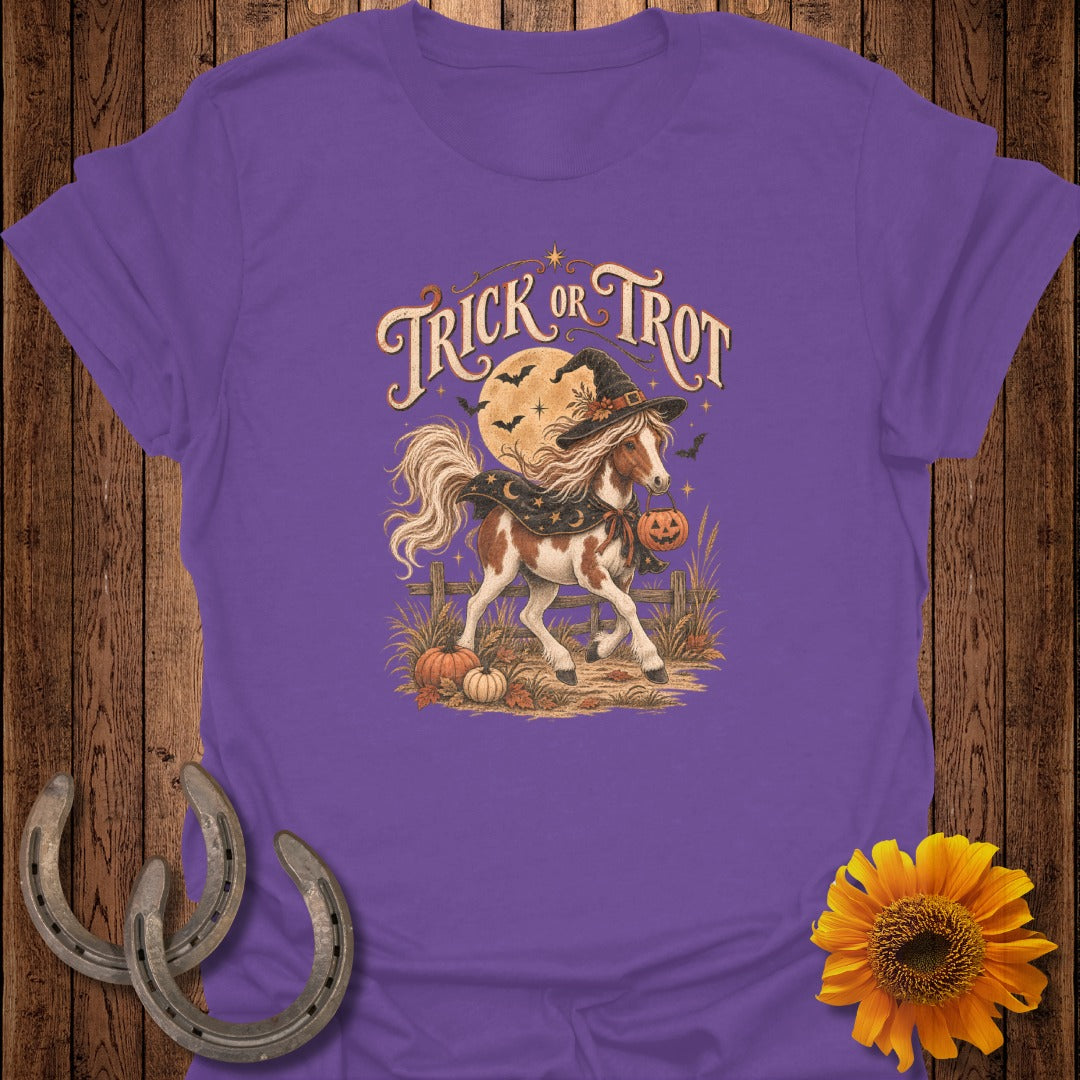 Horse wearing witch hat and cloak, carrying pumpkin, with text "Trick or Trot".
