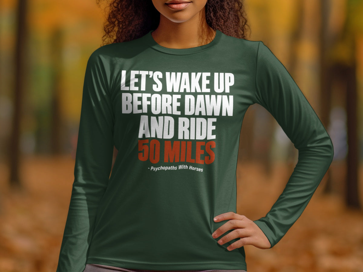 A woman wears a long-sleeved dark green shirt printed with white and orange text.