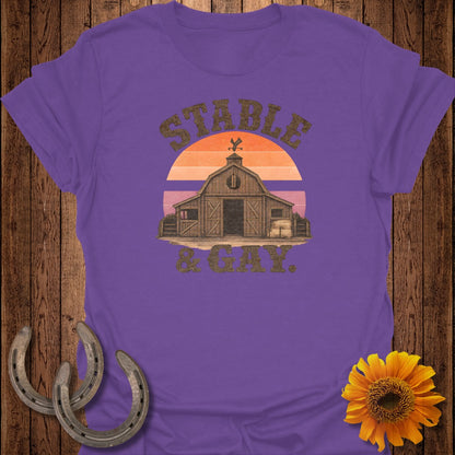 Purple t-shirt with barn, sunset, and "Stable & Gay" text.