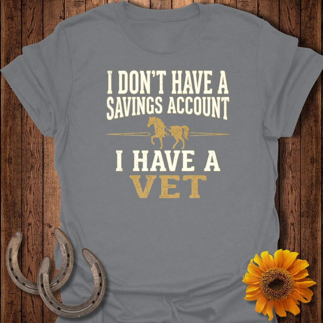 Grey t-shirt with "I DON'T HAVE A SAVINGS ACCOUNT I HAVE A VET" and two horses.