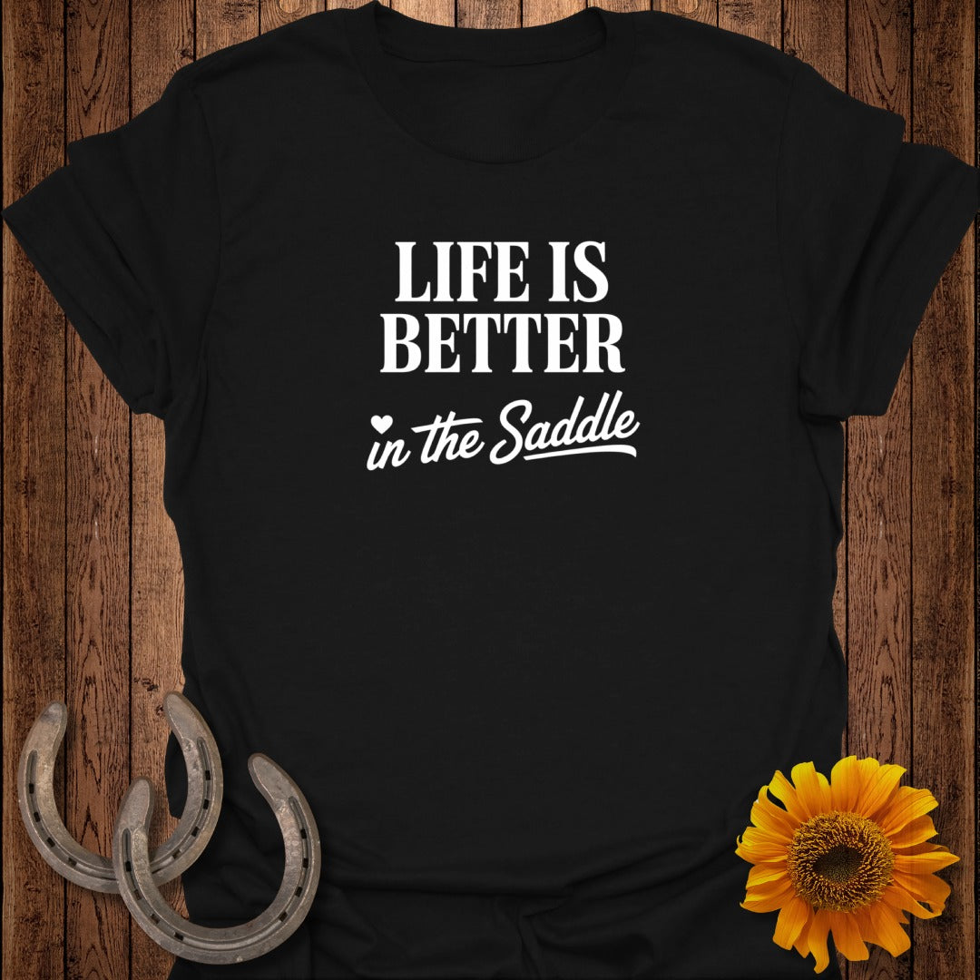 Black t-shirt with "Life is Better in the Saddle" text, horse shoes, and sunflower.