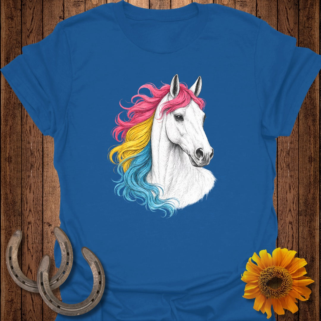White horse with rainbow mane on a blue t-shirt.