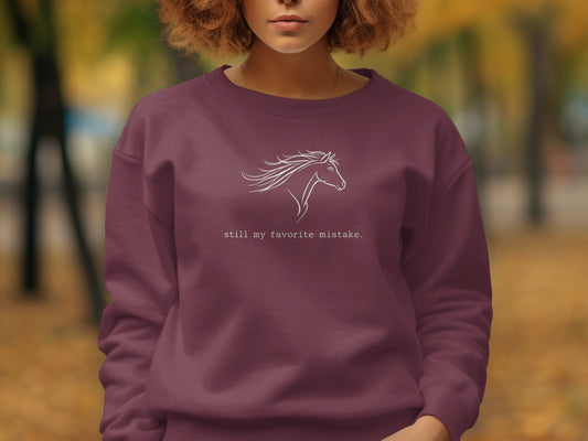 Burgundy sweatshirt with white horse outline and text "still my favorite mistake."