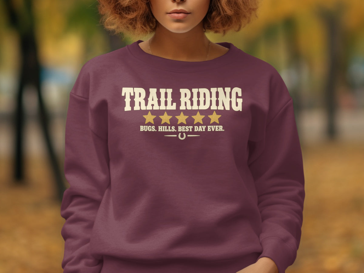 Maroon sweatshirt with "TRAIL RIDING" and five gold stars.
