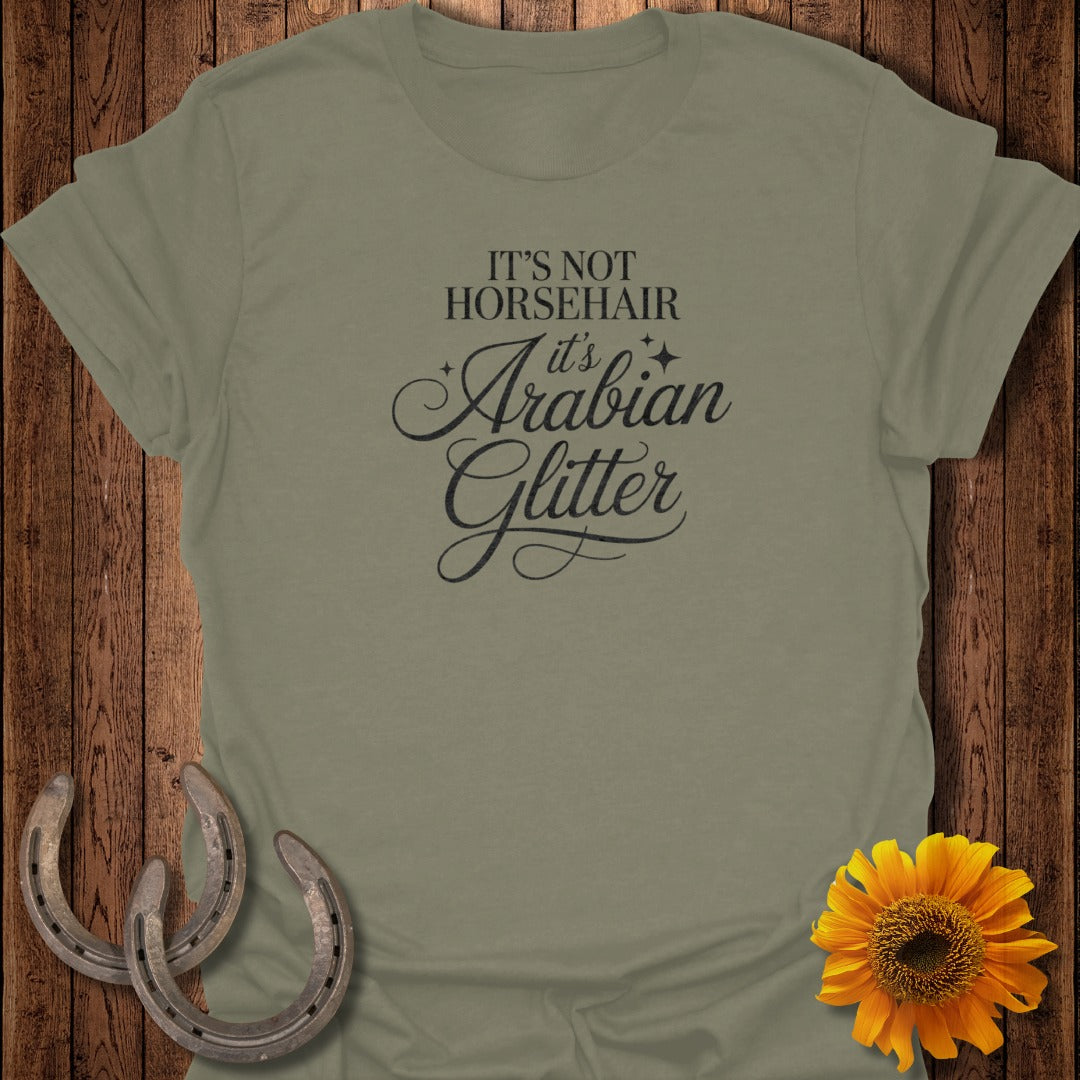 Olive green t-shirt with "It's Not Horsehair, It's Arabian Glitter" text.