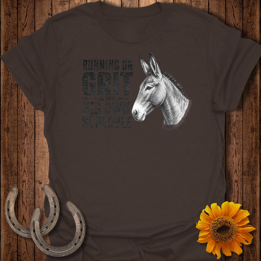 Brown t-shirt with a donkey head and text reading "Running on Grit and His Own Schedule."