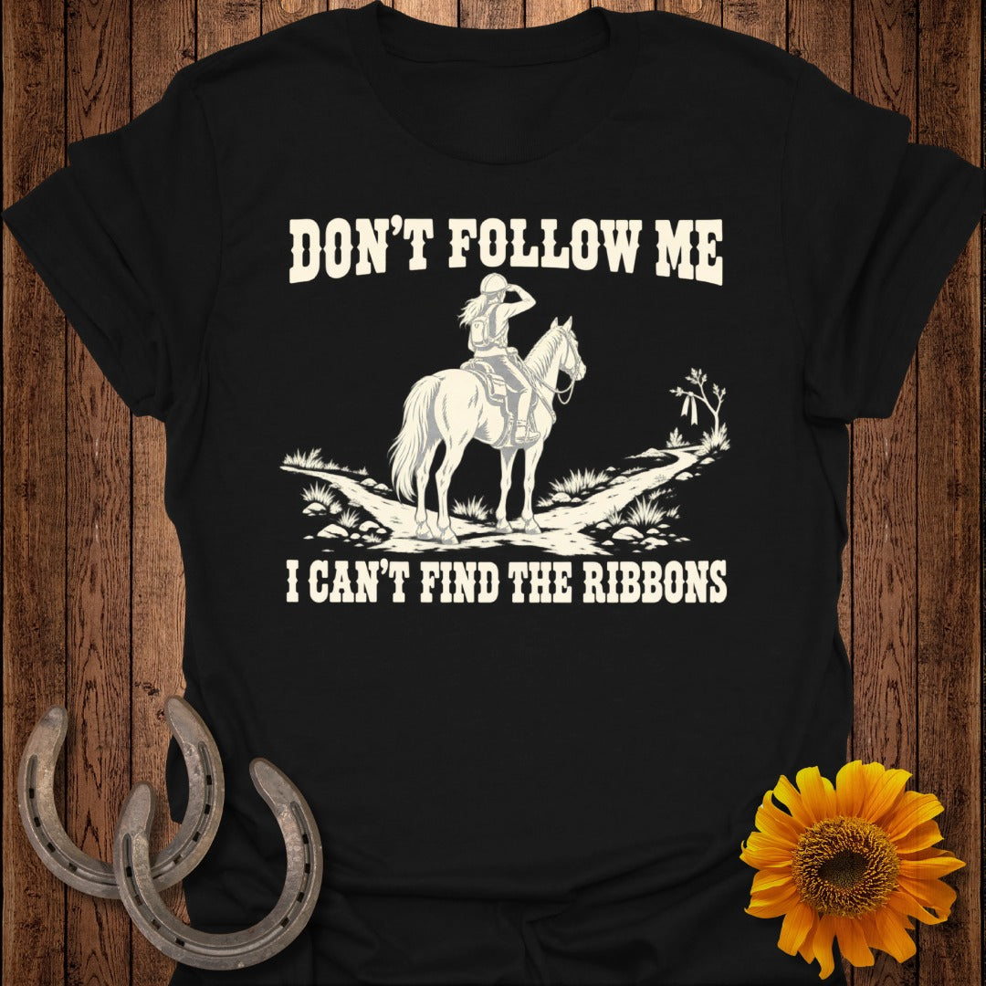 Black t-shirt with white text "DON'T FOLLOW ME I CAN'T FIND THE RIBBONS" and horse graphic.