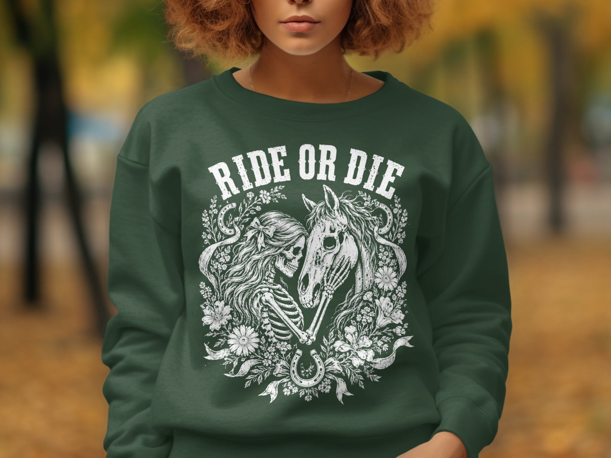 Green sweatshirt with white "RIDE OR DIE" text and skeleton/horse floral design.