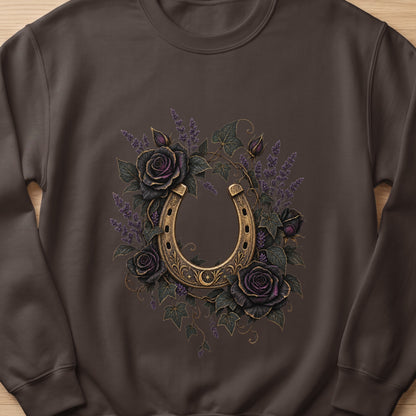 Brown sweatshirt with ornate gold horseshoe surrounded by dark roses and lavender.