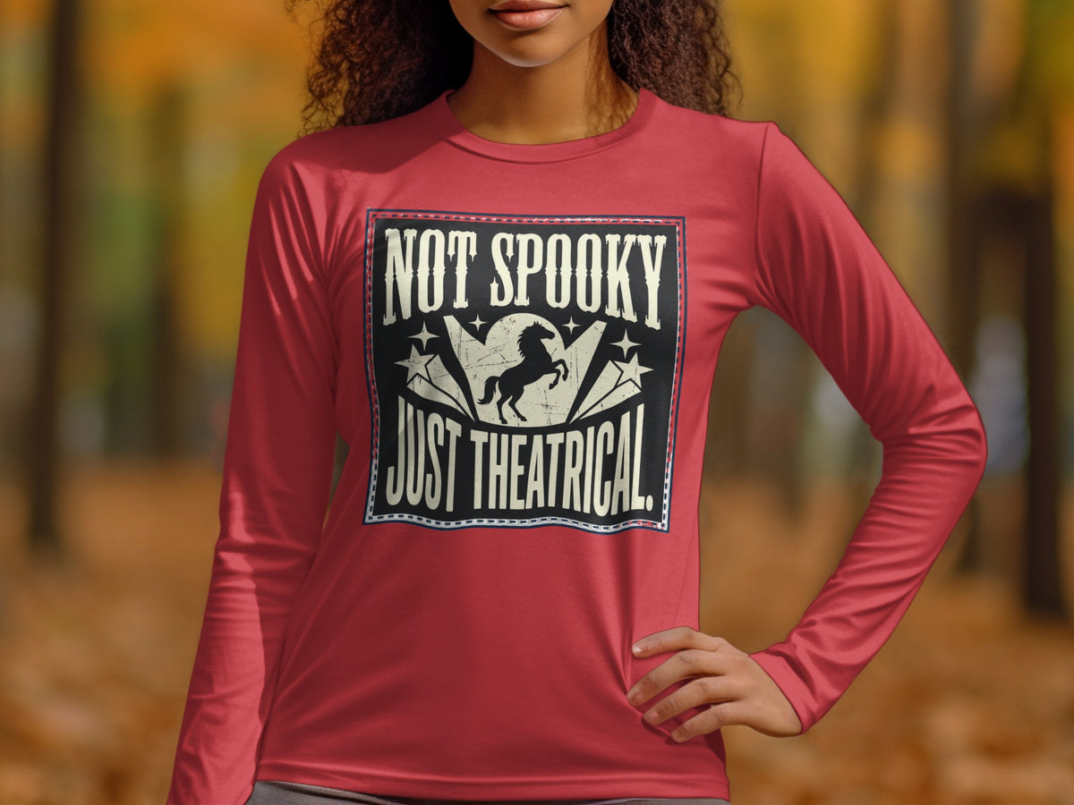 Red long sleeve shirt with "NOT SPOOKY JUST THEATRICAL" text and horse graphic.