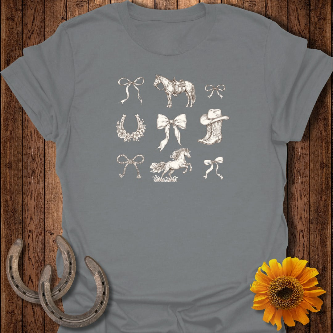 Collection of horseshoes, bows, cowboy boots, and horses on a grey t-shirt.