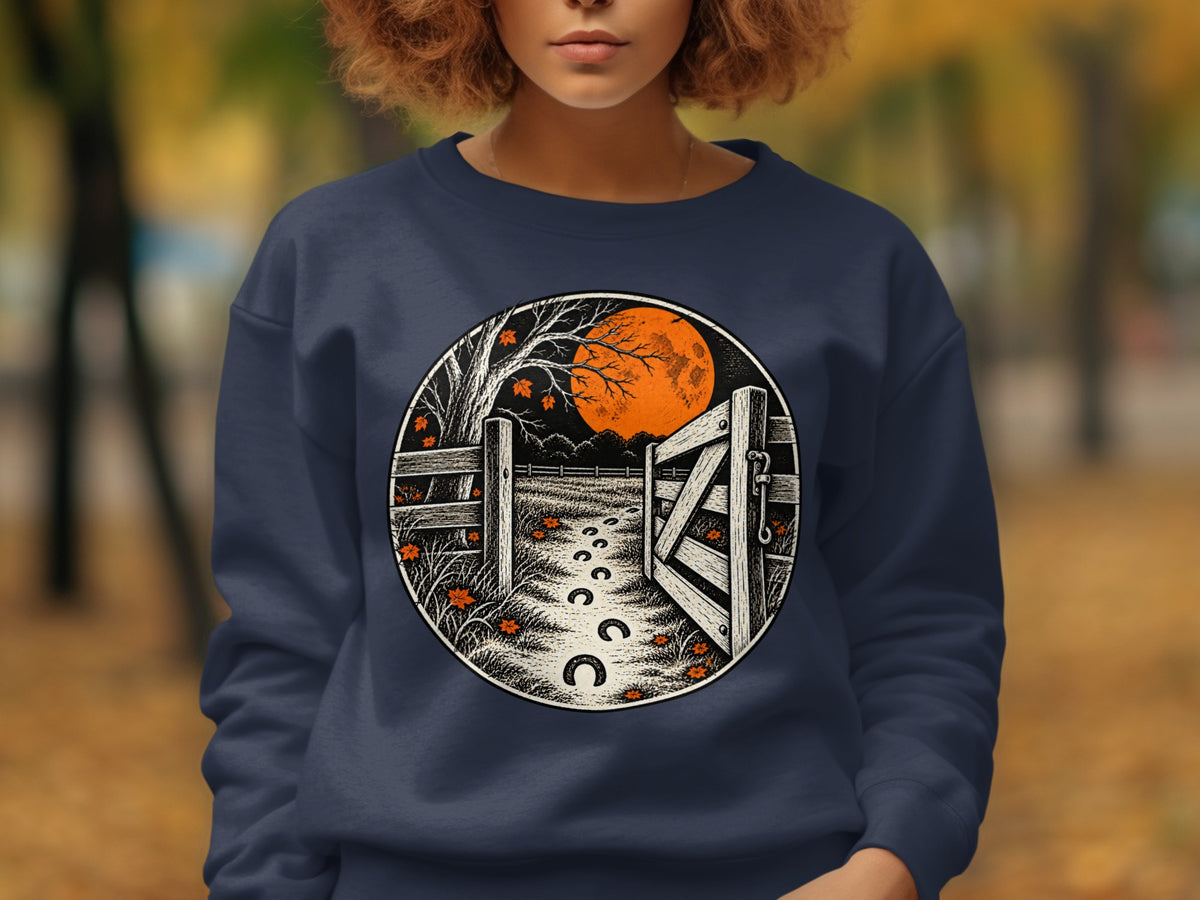 Dark blue sweatshirt with a circular graphic of an open gate, moon, and horseshoe tracks.