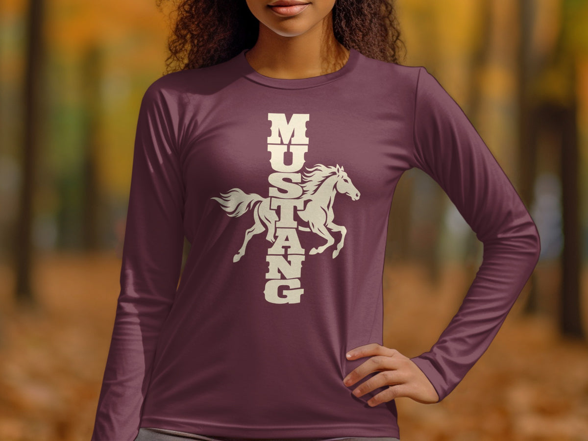 A woman wearing a long-sleeved plum shirt featuring a white graphic of a galloping horse with the vertical text Mustang.