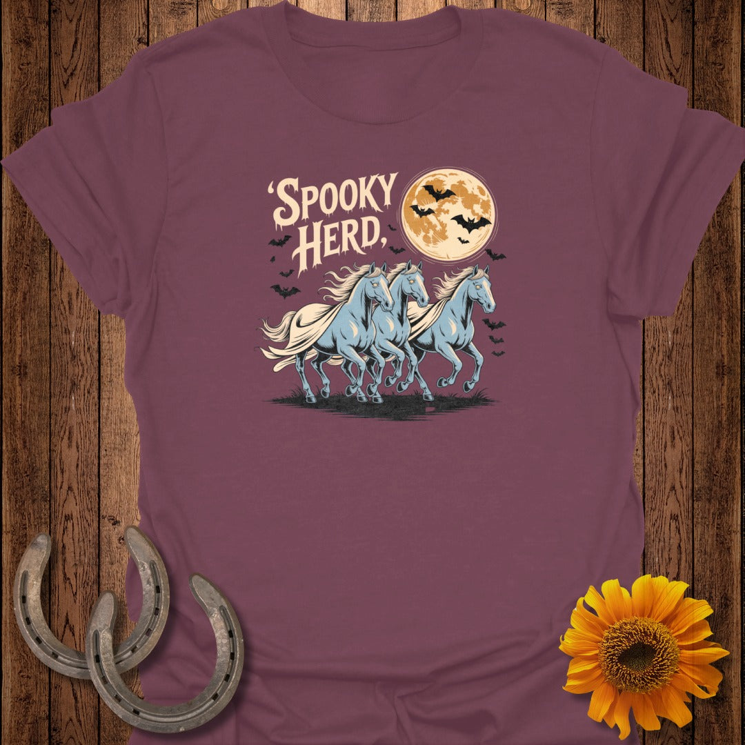 "Spooky Herd" text above three light blue horses running under a full moon with bats.