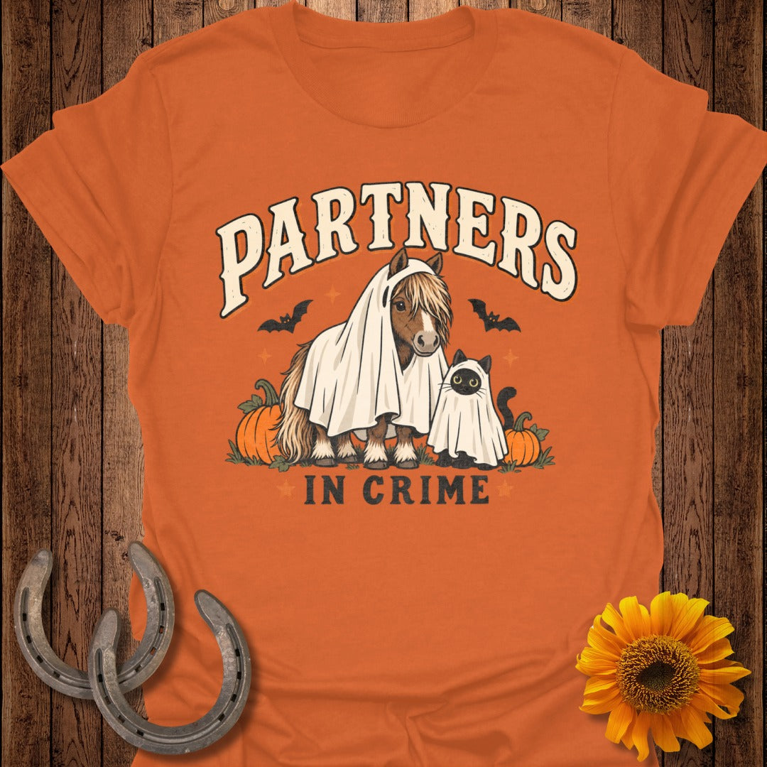 Horse and cat in ghost costumes with pumpkins and text "PARTNERS IN CRIME".