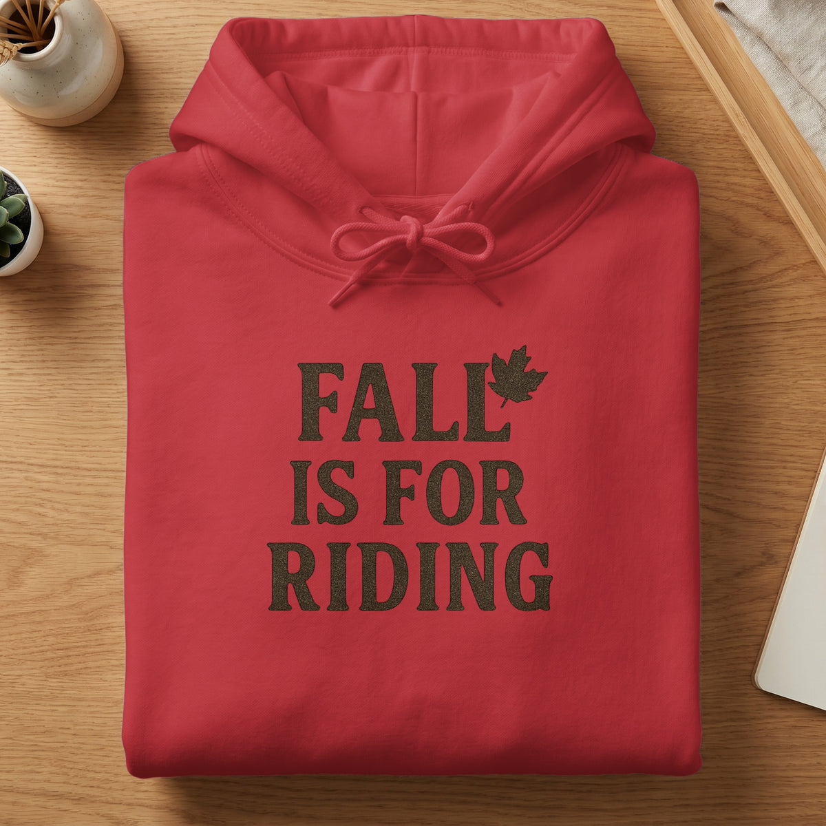 Red hoodie with "FALL IS FOR RIDING" text and a maple leaf graphic.