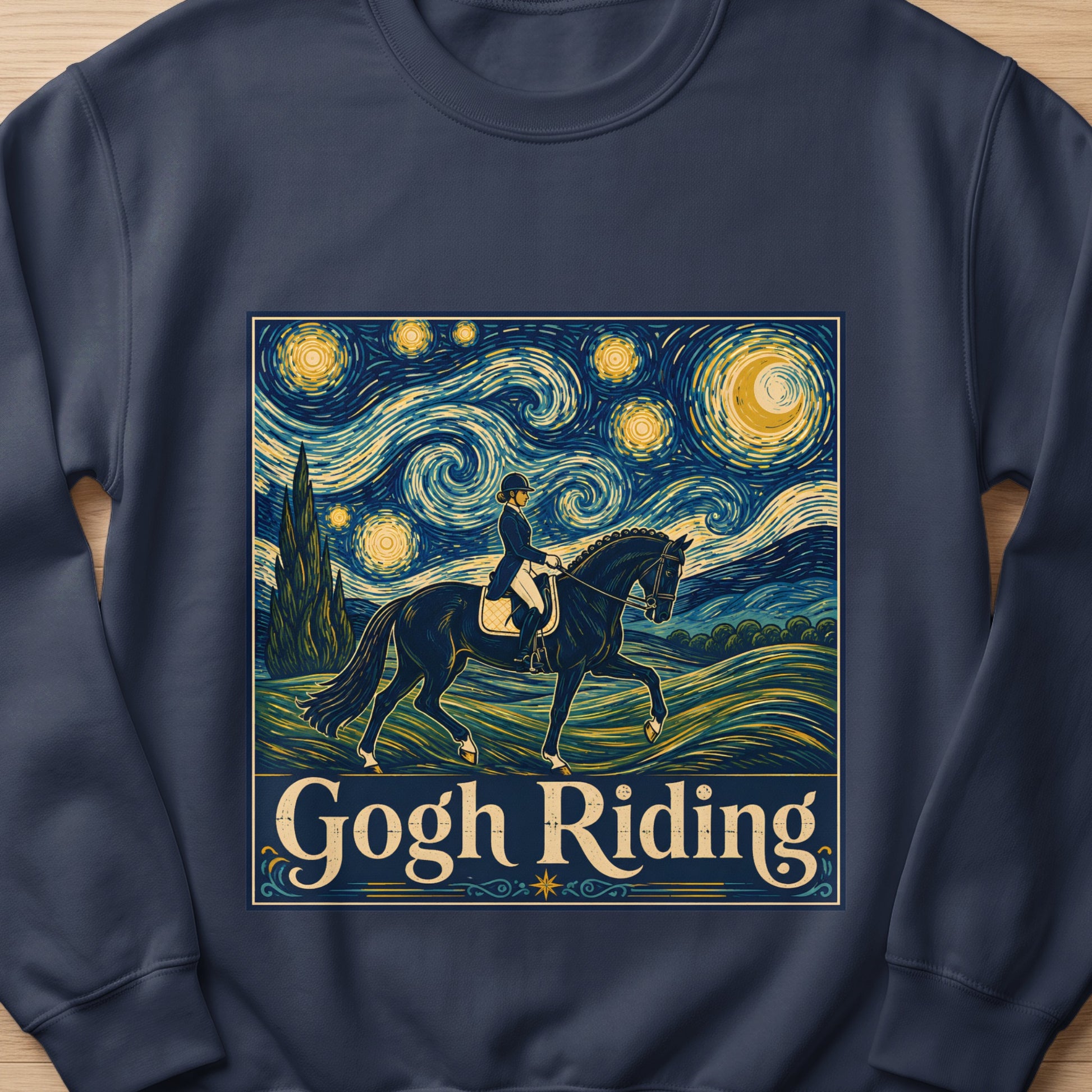 Dark blue sweatshirt featuring a graphic of a horse and rider under a Van Gogh-inspired night sky with the text "Gogh Riding."