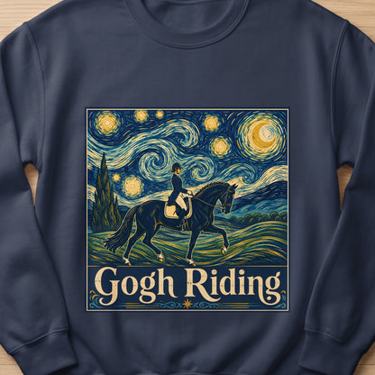 Dark blue sweatshirt featuring a graphic of a horse and rider under a Van Gogh-inspired night sky with the text "Gogh Riding."