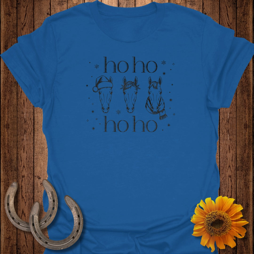 Blue t-shirt with three horse heads, a Santa hat, and a scarf, with "ho ho" text.