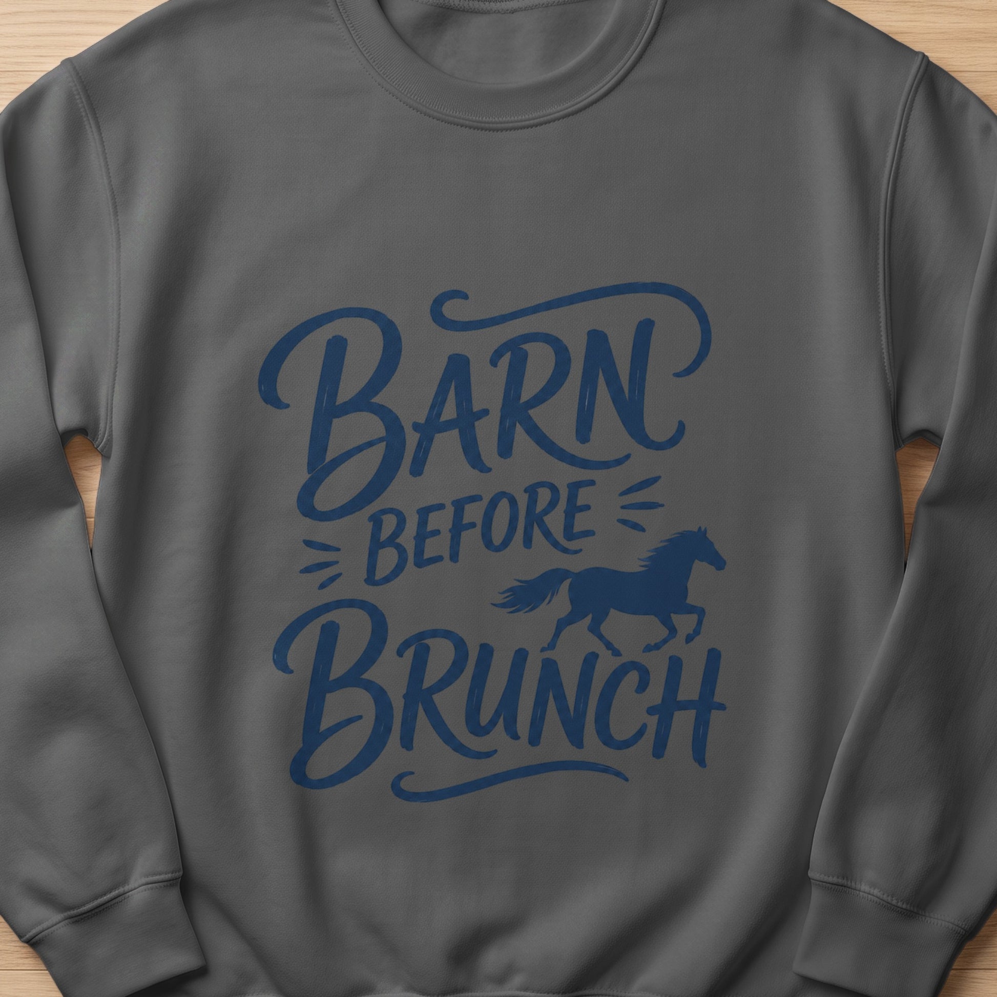 Dark grey sweatshirt with blue "Barn Before Brunch" text and a horse graphic.