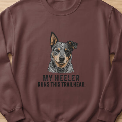 Heeler dog portrait on brown sweatshirt with text "MY HEELER RUNS THIS TRAILHEAD."