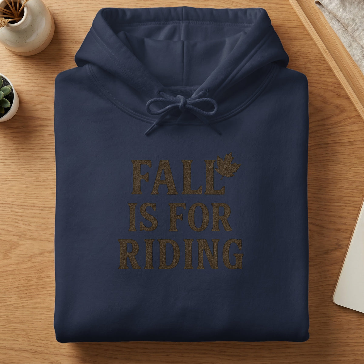 Navy blue hoodie with "Fall Is For Riding" text and maple leaf graphic.