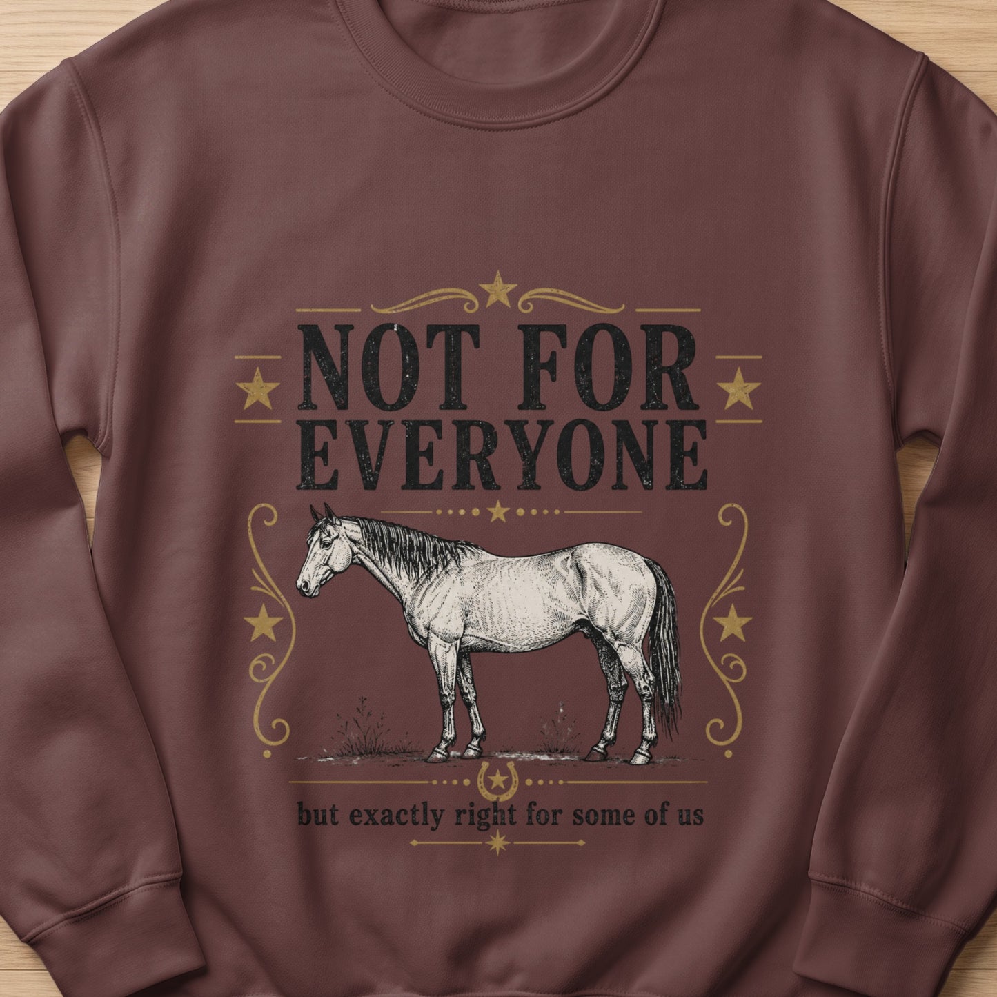 Brown sweatshirt with a vintage horse illustration and text.