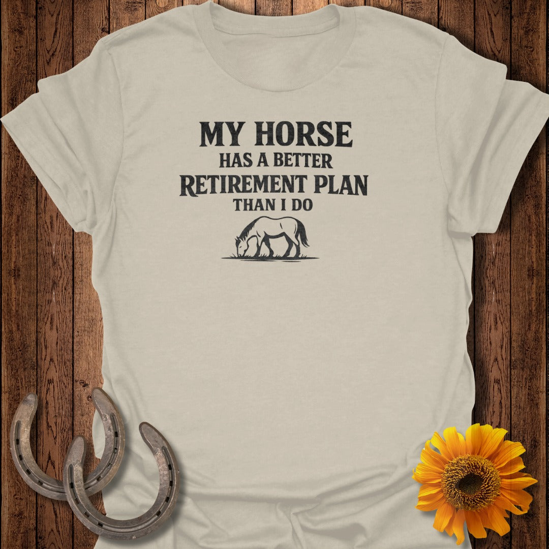 Light beige t-shirt with "My Horse Has A Better Retirement Plan Than I Do" text and horse graphic.
