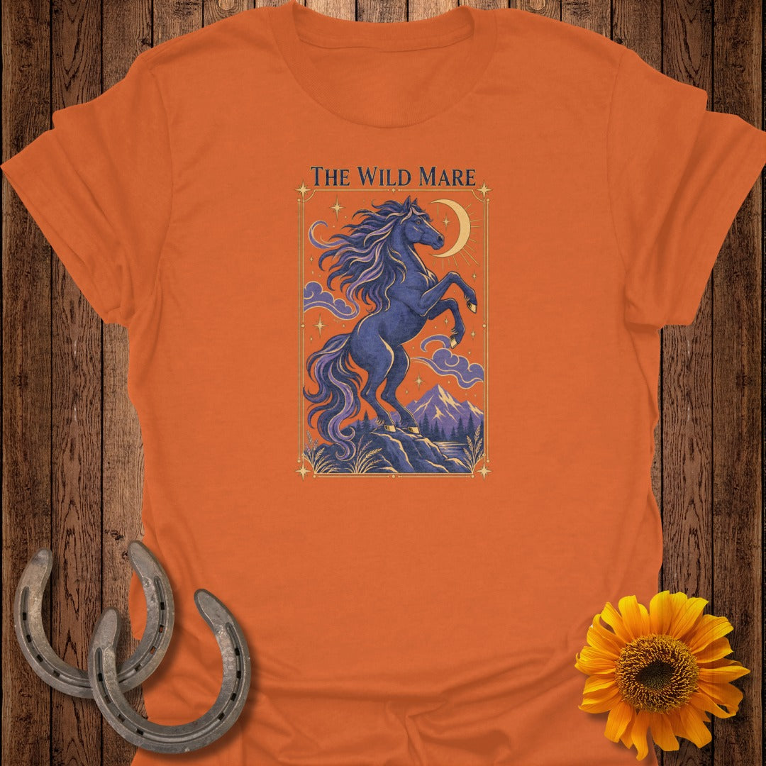 Orange t-shirt with "The Wild Mare" text and a dark blue horse on a rocky landscape.