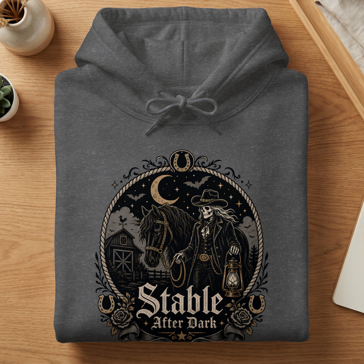 Dark gray hoodie with "Stable After Dark" graphic featuring a skeleton cowboy and horse.