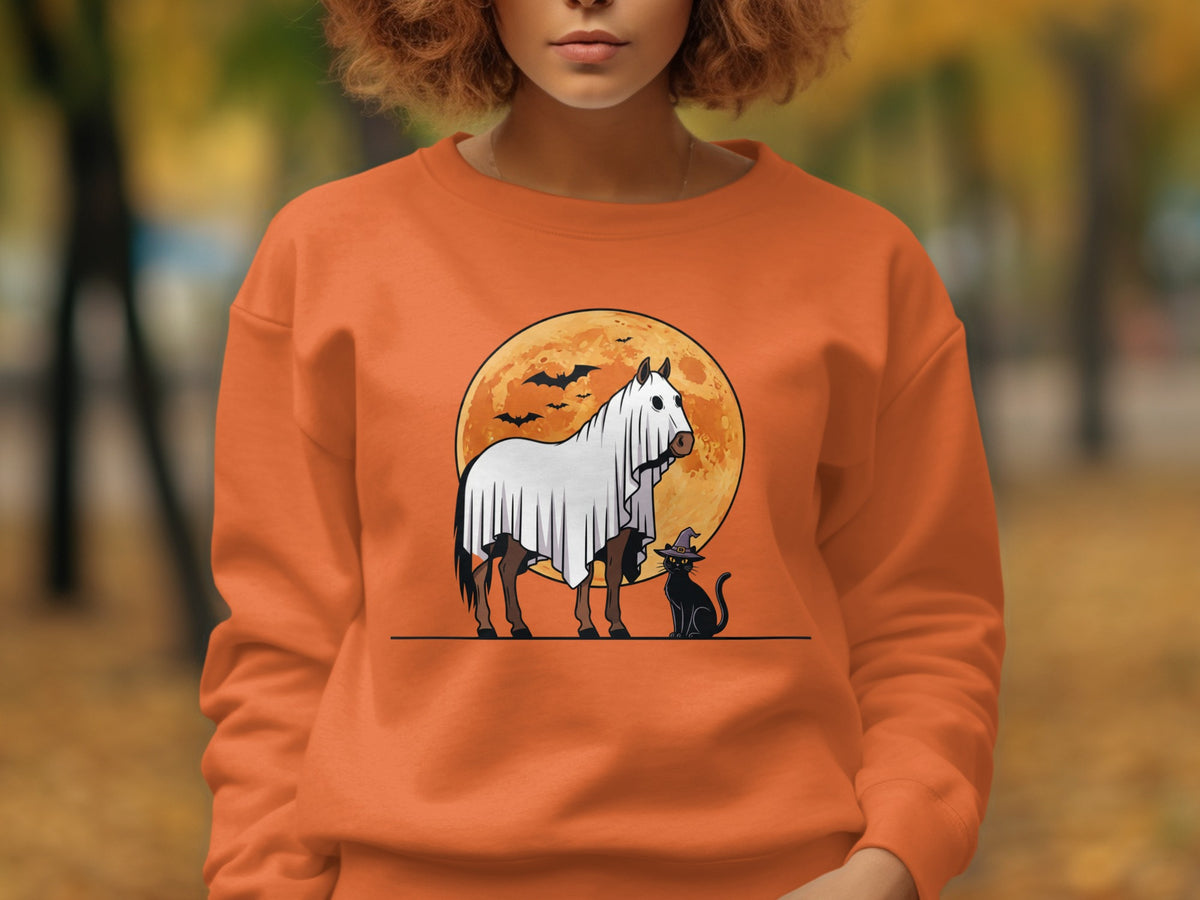 Horse in ghost costume with black cat and bats against a full moon background.