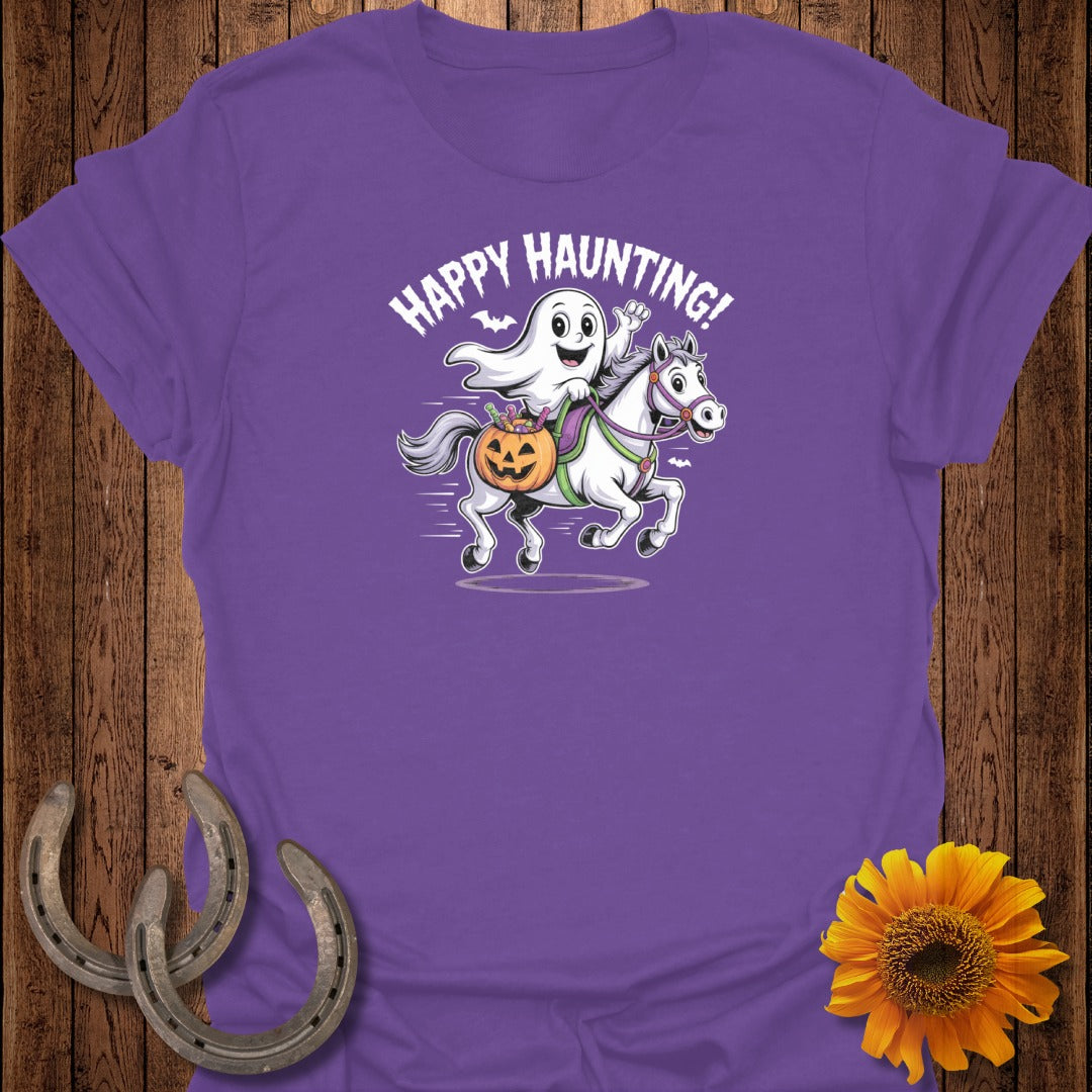 Purple t-shirt with a ghost riding a horse and the text "Happy Haunting!".