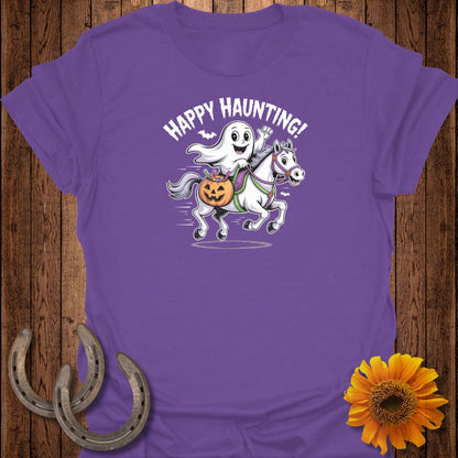 Purple t-shirt with a ghost riding a horse and the text "Happy Haunting!".