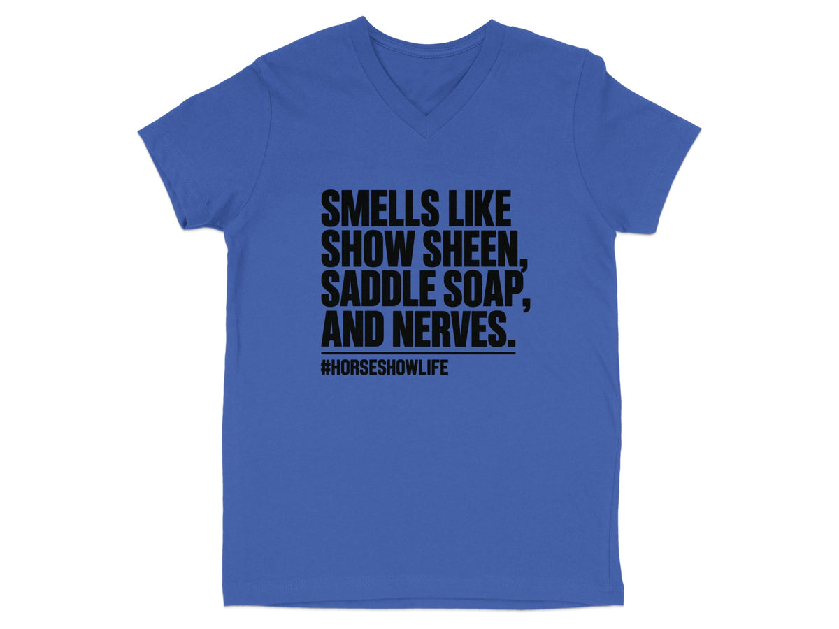Blue v-neck t-shirt with black text reading "SMELLS LIKE SHOW SHEEN, SADDLE SOAP, AND NERVES. #HORSESHOWLIFE".