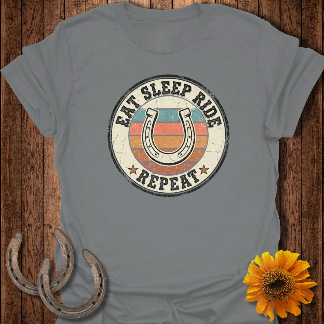 Gray t-shirt with "Eat Sleep Ride Repeat" and horseshoe graphic.