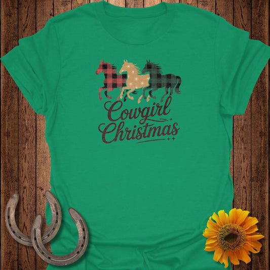 Green t-shirt with "Cowgirl Christmas" text and three plaid horses.
