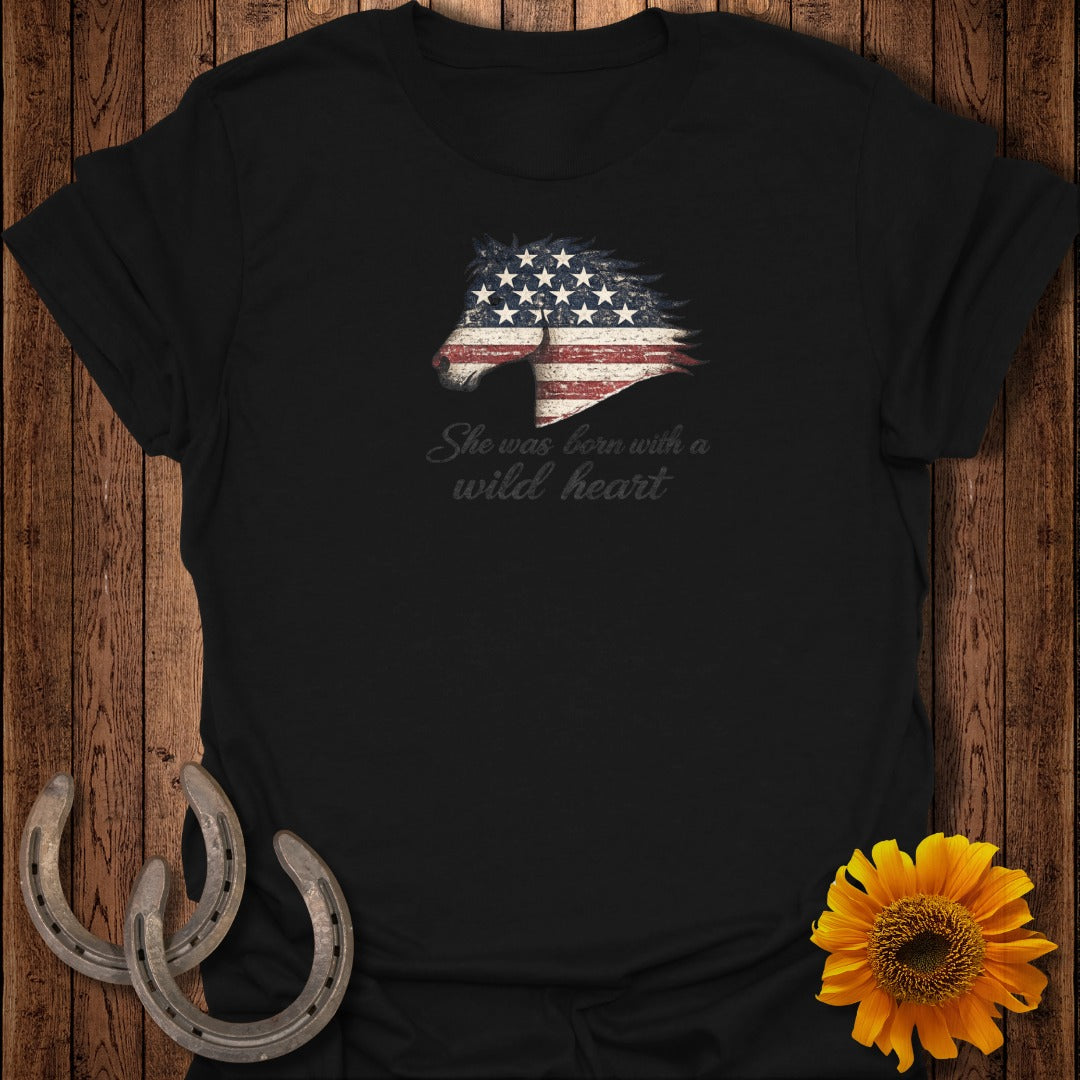 Black t-shirt with American flag horse head and text "She was born with a wild heart".